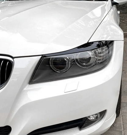 Strålkastarlister / ögonbryn sats för BMW E90 / E91 (05-11), blank svart